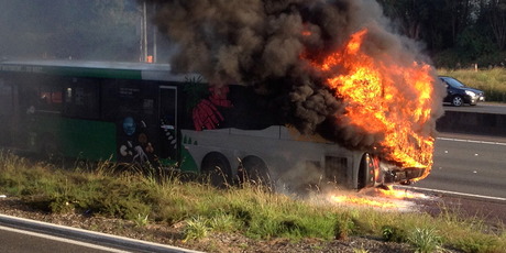 The Go Bus caught fire on Auckland's Northwestern motorway. Photo / Simon Nash