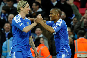 Chelsea's Florent Malouda, right, is congratulated by team mate Fernando Torres after scoring a goal against Tottenham Hotspur. Photo / AP