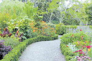 Manicured paths lead through the Kaipara Sculpture Gardens, created on what was once farmland. Photo / Supplied