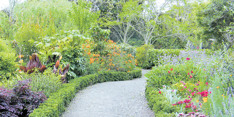 Manicured paths lead through the Kaipara Sculpture Gardens, created on what was once farmland. Photo / Supplied
