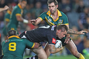 Shaun Kenny-Dowall of the Kiwi's is tackled by Paul Gallen and Cameron Smith of the Kangaroos. Photo / Getty Images