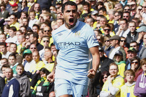 Manchester City's Carlos Tevez celebrates after scoring their third goal against Norwich City during their English Premier League match at Carrow Road. Photo / AP