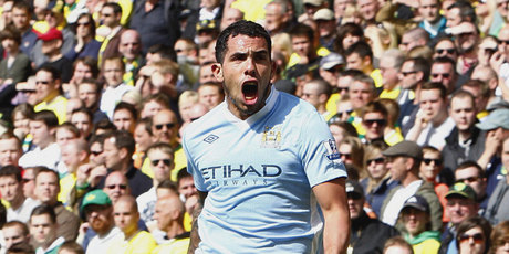 Manchester City's Carlos Tevez celebrates after scoring their third goal against Norwich City during their English Premier League match at Carrow Road. Photo / AP