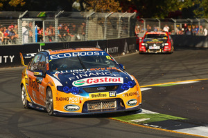 Will Davison is chased by Garth Tander in the V8 Supercar series yesterday.
Photo / Getty Images