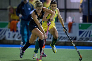 Black Stick Gemma Flynn (left) fights for possession in last night's match against Australia. Picture / Sarah Ivey