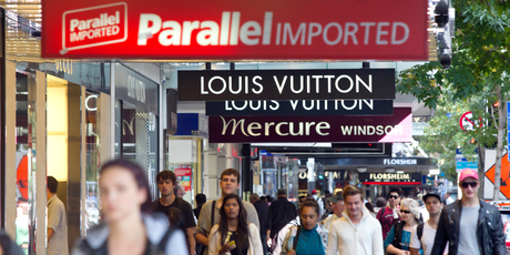 Lower Queen St's shopping precinct is all over the shop, with a couple of luxury retailers sandwiched in between souvenir shops, money exchanges, fast food outlets, and banks. Photo / Steven McNicholl