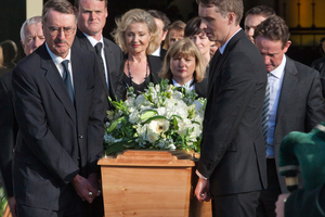 Alastair Haigh (right), son of the late John Haigh QC, carries his father's casket as it is piped from the Holy Trinity Cathedral. Photo / NZ Herald