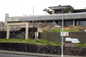 The unfinished house with seafront Paritai Drive frontage remains unsold. Photo / Janna Dixon