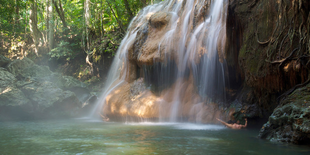 The Finca el Paraiso Falls near Rio Dulce are fed by a hot spring, providing wonderful pummelling massages for those who swim to its base. Photo / Thinkstock