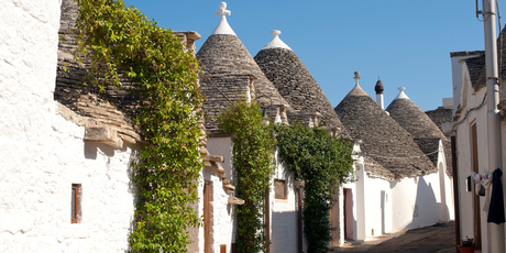 Distinctive trulli houses line a street in Alberobello, Puglia. Photo / Thinkstock