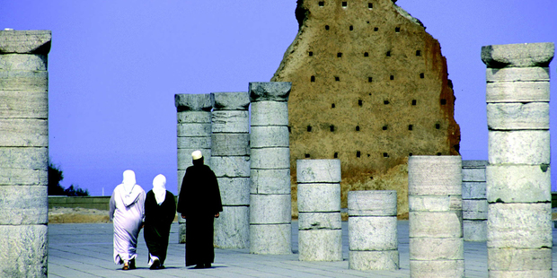 A Muslim family walk among the ruins of the grand mosque in Rabat, Morocco, which was destroyed by an earthquake in the 1700s. Photo / Kirsty Heron