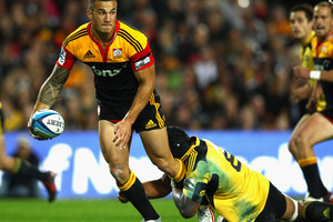 Sonny Bill Williams of the Chiefs is tackled by Victor Vito of the Hurricanes during the round 10 Super Rugby match between the Chiefs and the Hurricanes at Waikato Stadium. Photo / Getty Images.