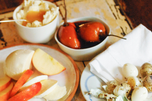 A tasting platter of quail eggs, apple with fresh mozzarella, poached tamarillo and fresh ricotta and honey. Photo / Jason Dorday