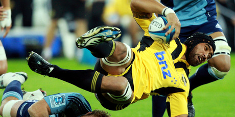 Victor Vito of the Hurricanes is tackled during the round 11 Super Rugby match between the Hurricanes and the Blues at Westpac Stadium. Photo / Getty Images.