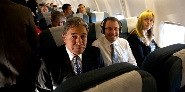 John Banks came under attack from NZ First leader Winston Peters, but the two were side by side yesterday as they flew to Wellington and into the parliamentary storm over the Dotcom scandal. Photo / David White