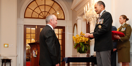 Sir Graham Henry is Knighted by the Governor General, Lieutenant General Sir Jerry Mateparae, during the investiture ceremony at Government House in Wellington today. Photo / Mark Mitchell