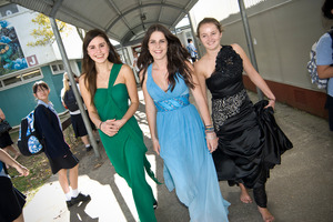 Lena Kemp (in green) Nicole Kruger (blue) and Karlien Burger model last year's outfits. Photo / Michael Craig
