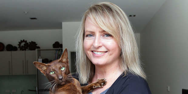 Duff the cat with owner Angela Dyer. Photo / Doug Sherring
