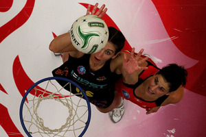 The Magic's Irene van Dyk shoots under pressure from Tactix defender Anna Galvanin Rotorua. Photo / Alan Gibson