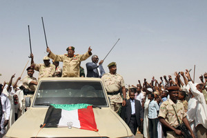 Sudanese President Omar al-Bashir (centre) has lashed out in terms reminiscent of the Hutu regime in Rwanda. Photo / AP