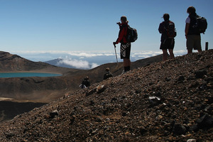 Tourists look towards Blue Lake during the Tongariro crossing. Photo / Greg Bowker