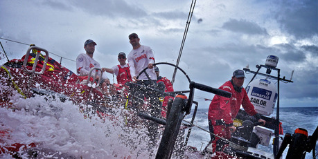 Another wave of water washes down the deck oonboard CAMPER with Emirates Team New Zealand during leg 6 of the Volvo Ocean Race 2011-12. Photo / Hamish Hooper.