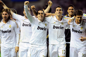 Players of Real Madrid celebrate after their team won the Spanish League at the end of their Spanish La Liga soccer match, against Athletic Bilbao, at San Mames stadium. Photo / AP