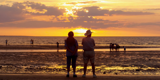 Sunset at Mindil Beach in Darwin. Every Thursday and Sunday night from April until October the beach plays host to sunset markets featuring more than 200 food, art and craft stalls. Photo / Thinkstock