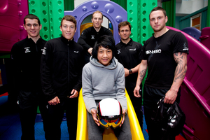 Starship patient Christian Toomata meets Olympic cyclists (from left) Sam Webster, Ethan Mitchell, Matt Archibald, Simon van Velthooven and Eddie Dawkins. Photo / Dean Purcell