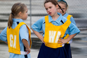 Seven-year-old netballers Evie Smoldon (left) and Alice Barry of the Good Shepherd Breakers at the re-opened courts in Mt Eden. Photo / Sarah Ivey