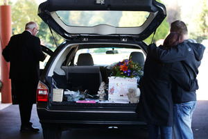 Shannon Pratt and Daniel Collier say goodbye to their son Kobi. Photo / Doug Sherring