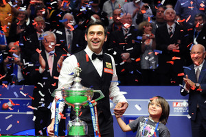 England's Ronnie O'Sullivan celebrates his victory with his son Ronnie. Photo / AP