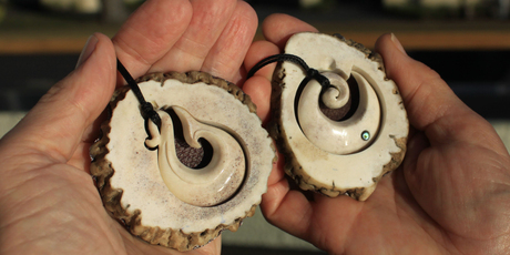 Fishhook and koru bone carvings produced by Jim and Chris Eagles at Pacific Carvers. Photo / Jim Eagles