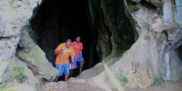 The entrance to Tau's hidden limestone caves, where villagers retreated during dangerous periods in the island's history. Photo / Jim Eagles