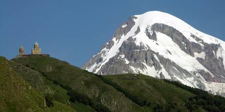 The 14th century Tsminda Sameba church is overlooked by 5047-metre Mt Kazbek. Photo / Thinkstock