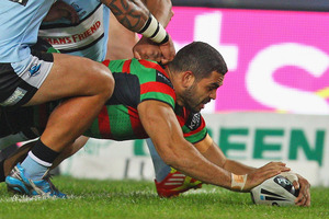 Greg Inglis crossed over three times against the Sharks. Photo / Getty Images