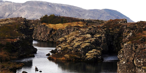Iceland is a land of volcanoes, earthquakes, geysers, strange geology, glaciers and vast plains. Pictured is a fissure in the earth around the meeting point of the north American and Eurasian tectonic plates. Photo / AAP