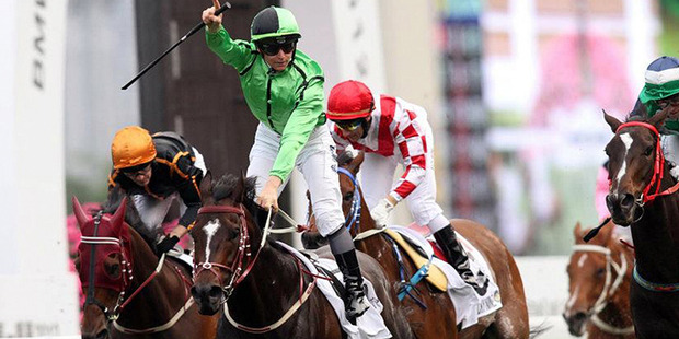 James McDonald's career appears headed skyward as he celebrates winning the BMW Champions Mile at Sha Tin on Sunday.Picture /Hong Kong Jockey Club