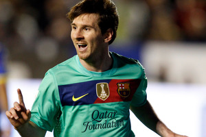 Barcelona's Lionel Messi from Argentina celebrates after scoring against Levante during their La Liga soccer match. Photo / AP