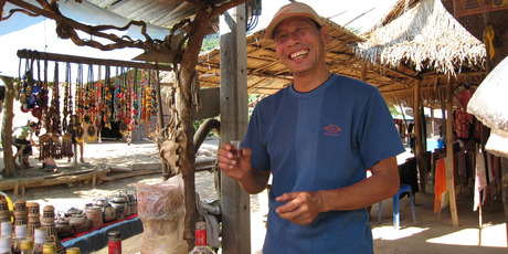 A man sells lao bong ya at Ban Xang Hai village. Photo / AAP