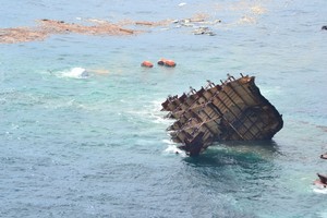 The stern section of the MV Rena is slipping off the Astrolabe Reef.
Photo / Maritime NZ