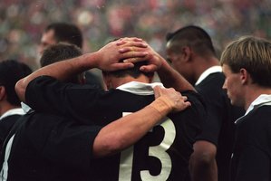 The All Blacks console one anoher after the 1995 Rugby World Cup final. Photo / Geoff Dale