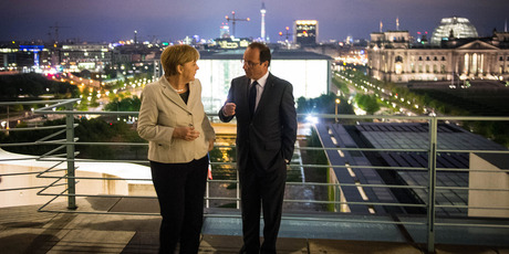 Angela Merkel, left, talks with new French President Francois Hollande. Photo / AP