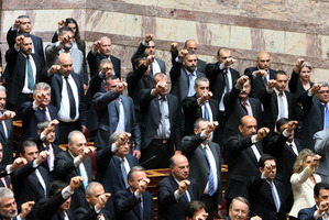 Members of parliament from the extreme right-wing Golden Dawn party, intermingled with other new lawmakers as they are sworn in during a ceremony at the Greek parliament in Athens. Photo / AP