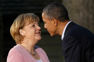 President Barack Obama greets German Chancellor Angela Merkel before the G8 Summit. Photo / AP