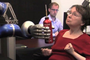 In a clinical trial, a woman used the BrainGate system to mentally control a robotic arm and reach for a drink. Photo / BrainGate Collaboration.