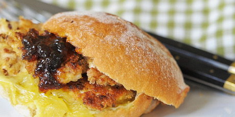 Chicken schnitzel served on a bun with plum jelly and cheese are a great treat to enjoy while watching telly. Photo / Jason Dorday