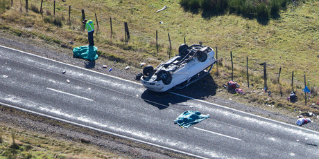 Police and firecrews at the scene of a vehicle rollover crash near Turangi that claimed the lives of three people. Photo / John Cowpland Police and firecrews at the scene of a vehicle rollover crash near Turangi that claimed the lives of three people. Photo / John Cowpland