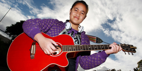 Singer and guitar player Legalo Tumana, 16, poses before auditioning for 'New Zealand's Got Talent' at Wellington Girls East College. Photo / Getty Images