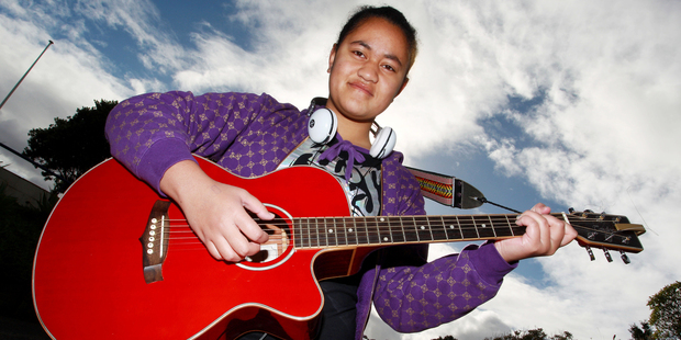 Singer and guitar player Legalo Tumana, 16, poses before auditioning for 'New Zealand's Got Talent' at Wellington Girls East College. Photo / Getty Images